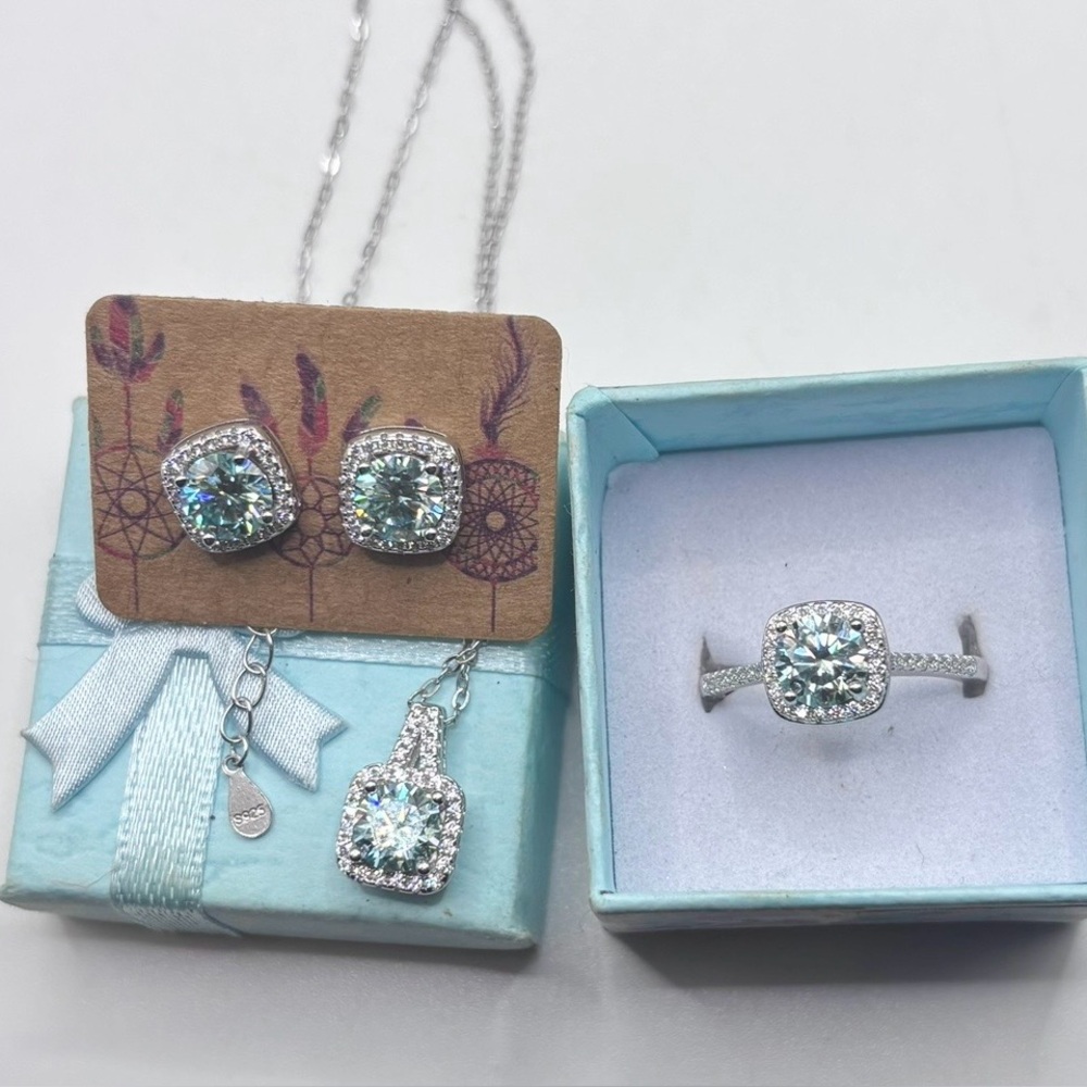 3 pc. Earrings, Necklace & Sz. 8 Ring Set
1 CT. Each Blue Ice MOISSANITE S925